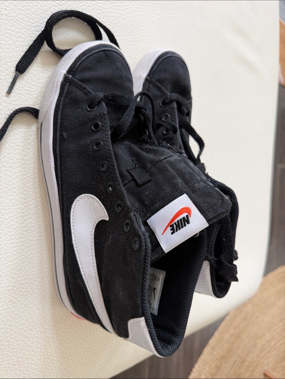 Nike Black High-Top Sneakers with White Swoosh and Red Logo Tag
